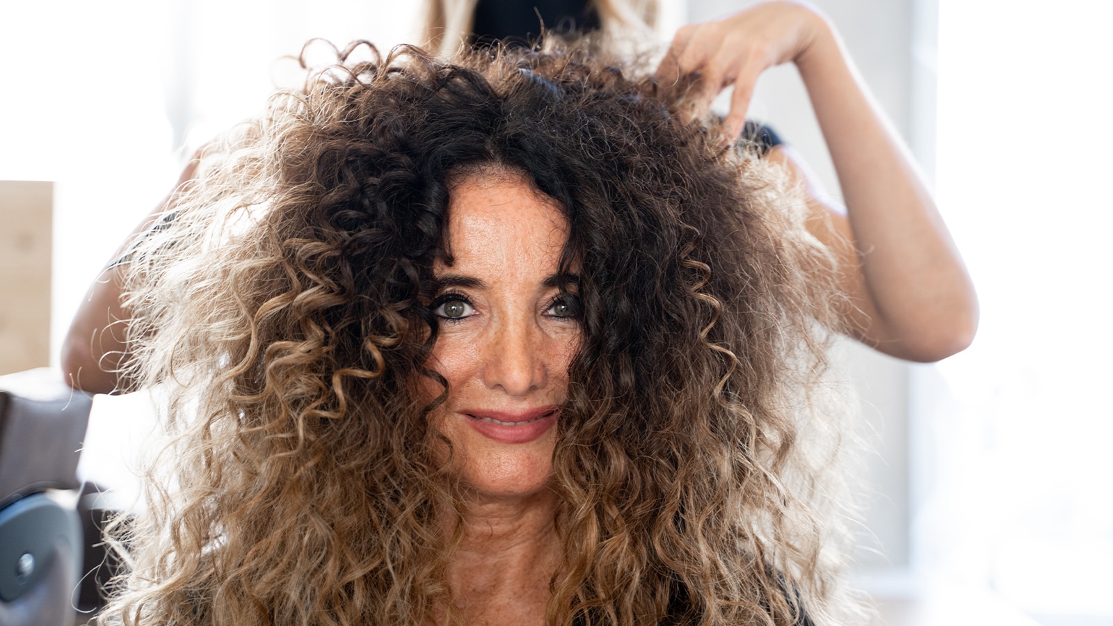 Woman battling humidity in her hair in houston