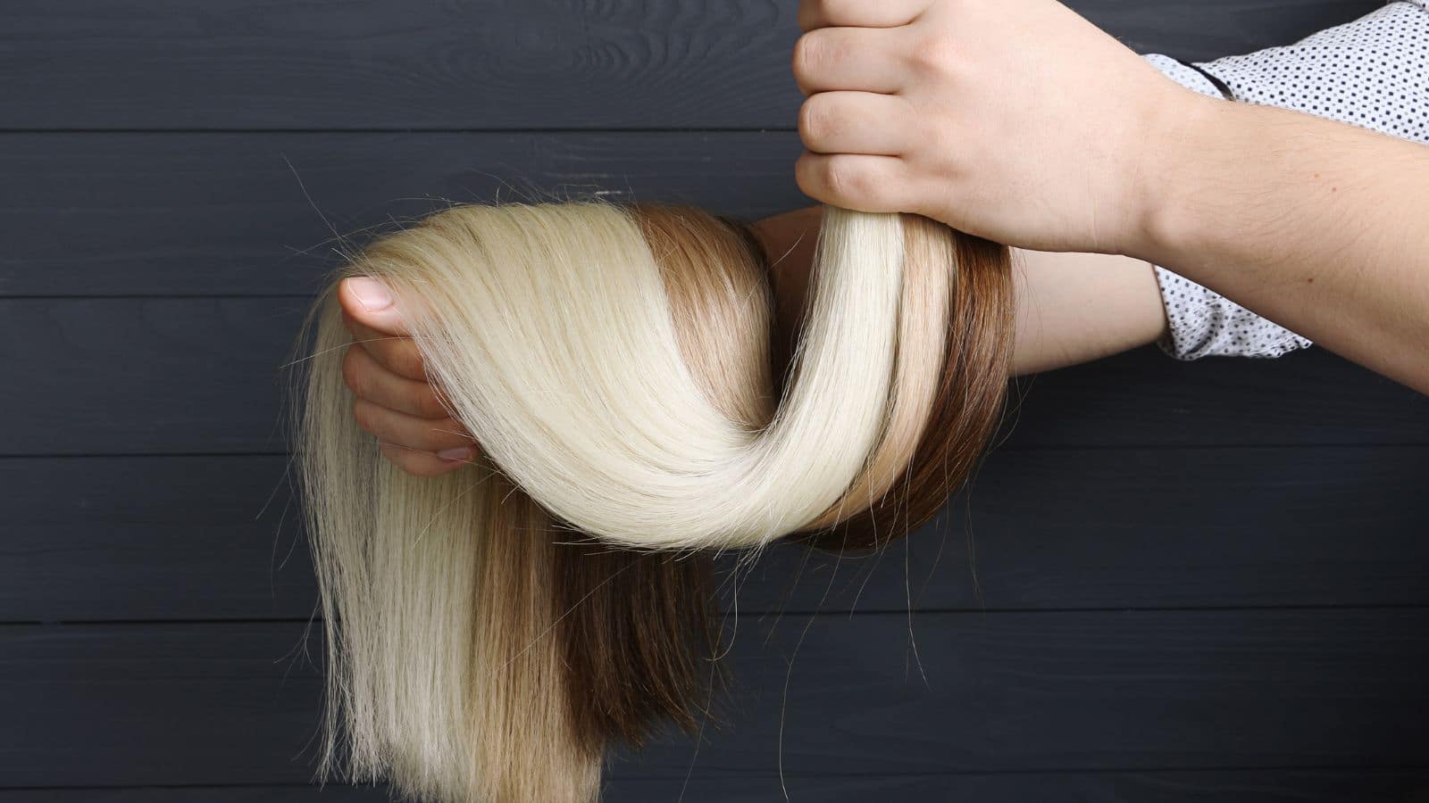 Man holding hair extensions