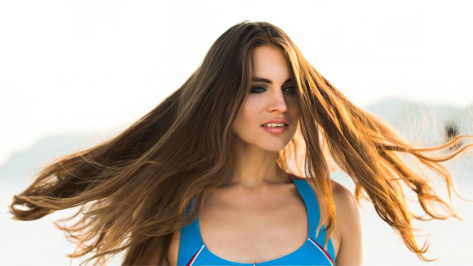 Woman with flowing hair extensions outside