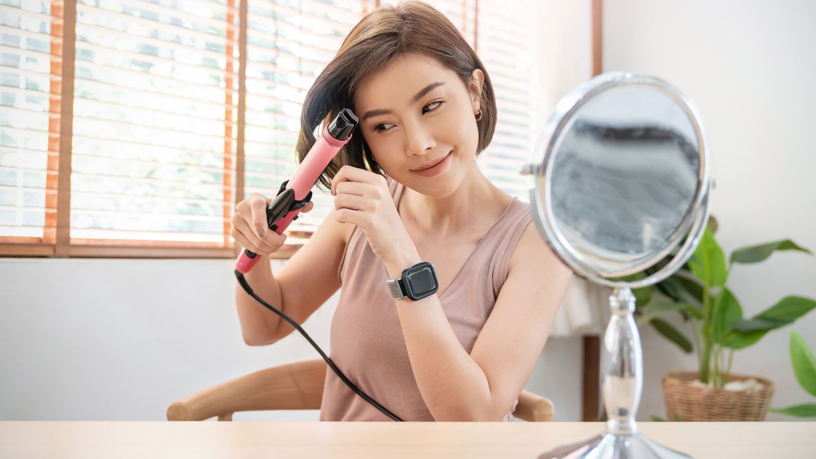 Woman with short hair styling it at home