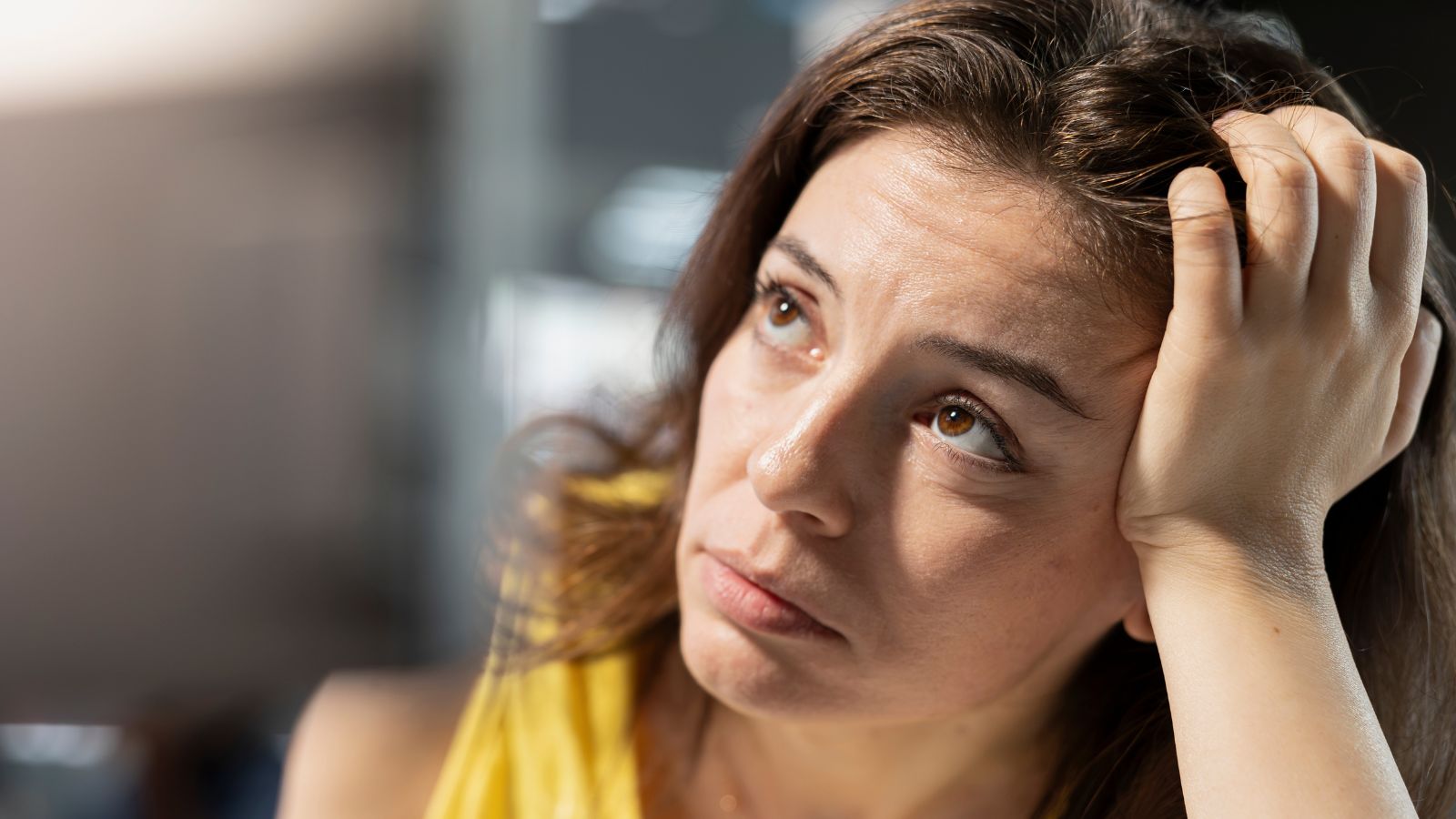 Woman depressed with her hair loss