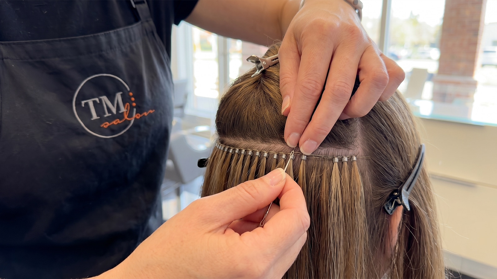 Installing NBR Hair Extensions at Trademark Salon in Houston
